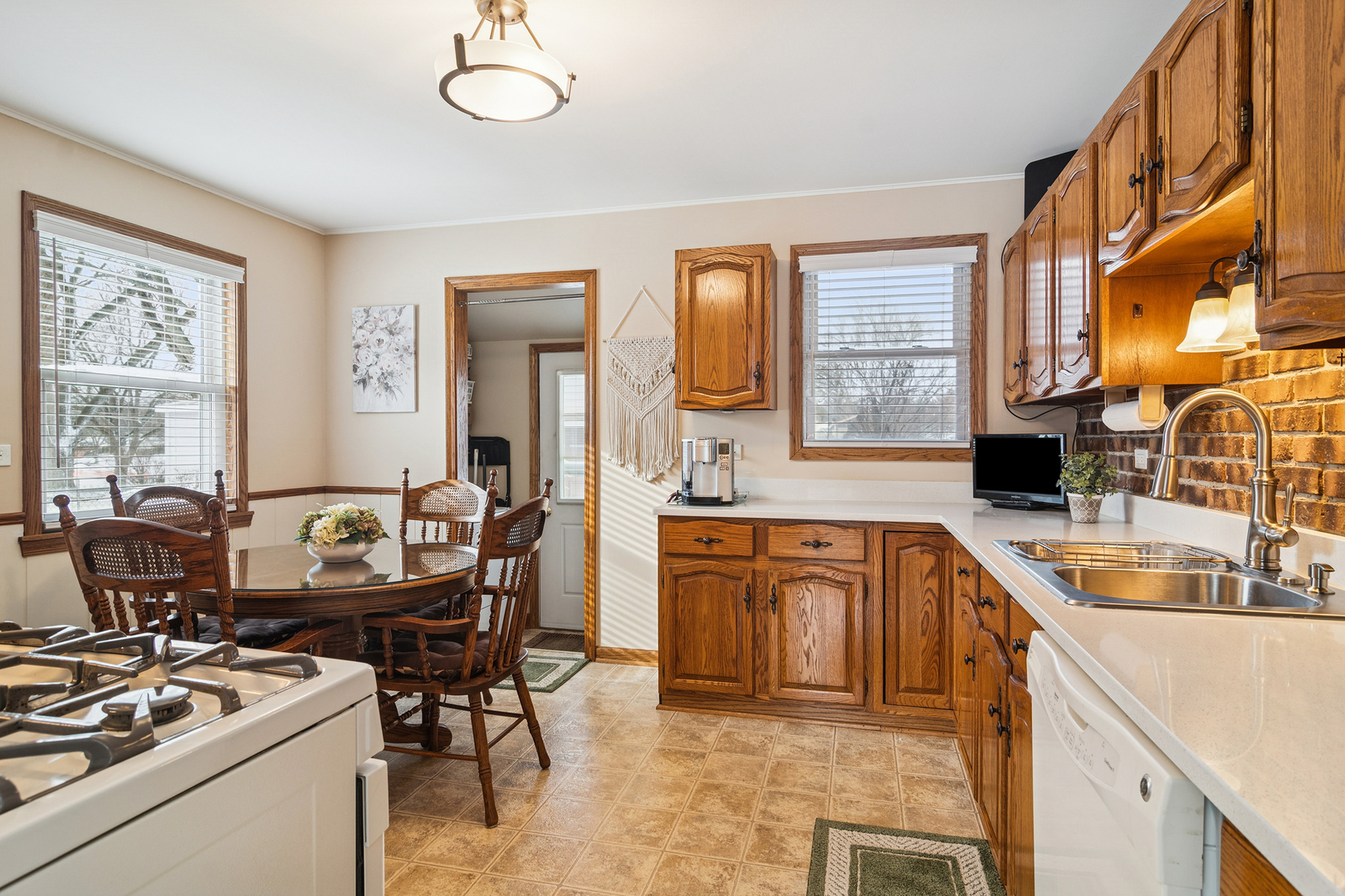 3407 Pheasant Drive Rolling Meadows, IL 60008 - Photo 4 of 16 a kitchen with stainless steel appliances granite countertop a sink stove and cabinets