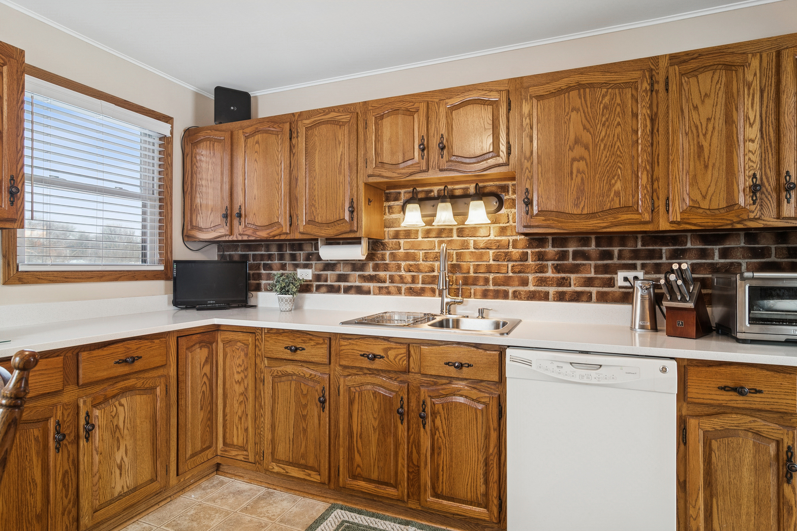 3407 Pheasant Drive Rolling Meadows, IL 60008 - Photo 7 of 16 a kitchen with stainless steel appliances granite countertop a sink stove and cabinets