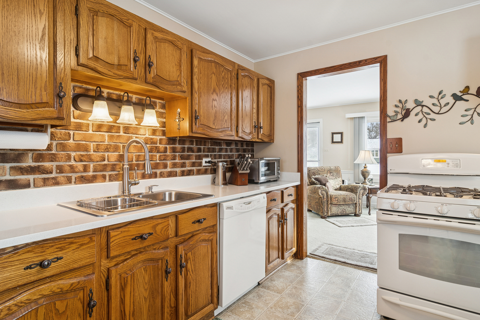 3407 Pheasant Drive Rolling Meadows, IL 60008 - Photo 8 of 16 a kitchen with stainless steel appliances granite countertop a sink and cabinets