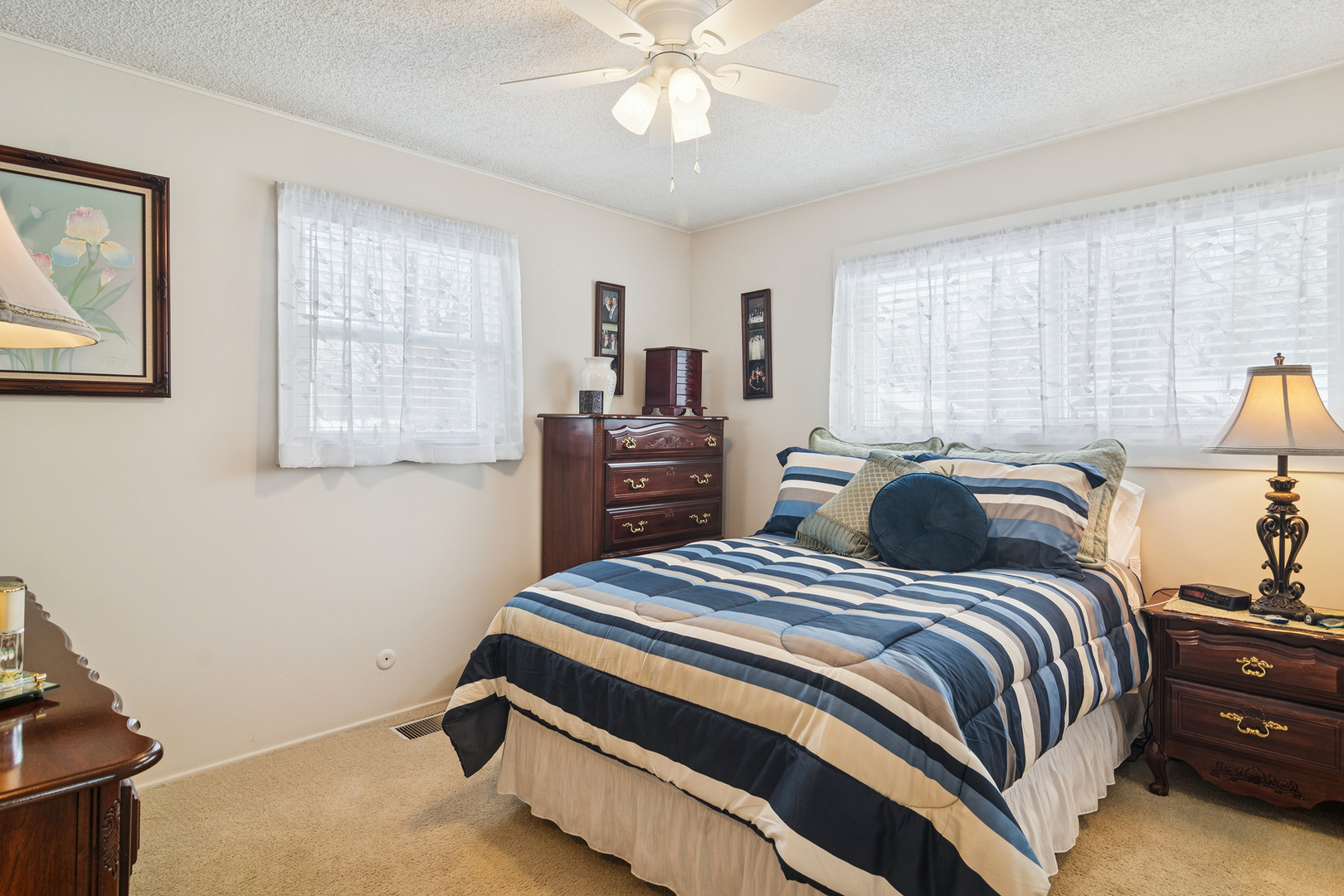 3407 Pheasant Drive Rolling Meadows, IL 60008 - Photo 9 of 16 a bedroom with a bed and a chandelier