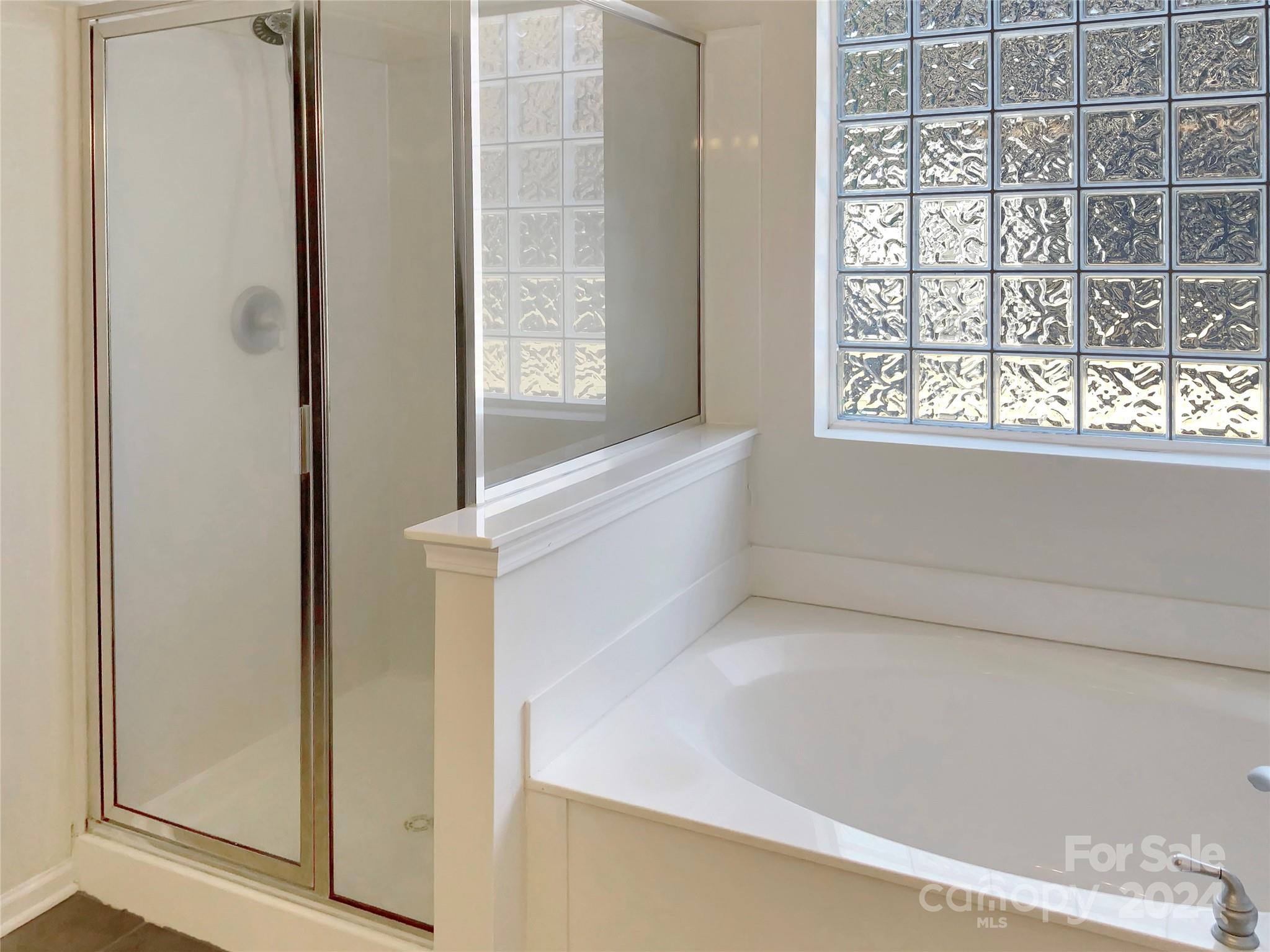 13413 Meadowmere Road Huntersville, NC 28078 - Photo 15 of 22 a view of bathroom and bathtub