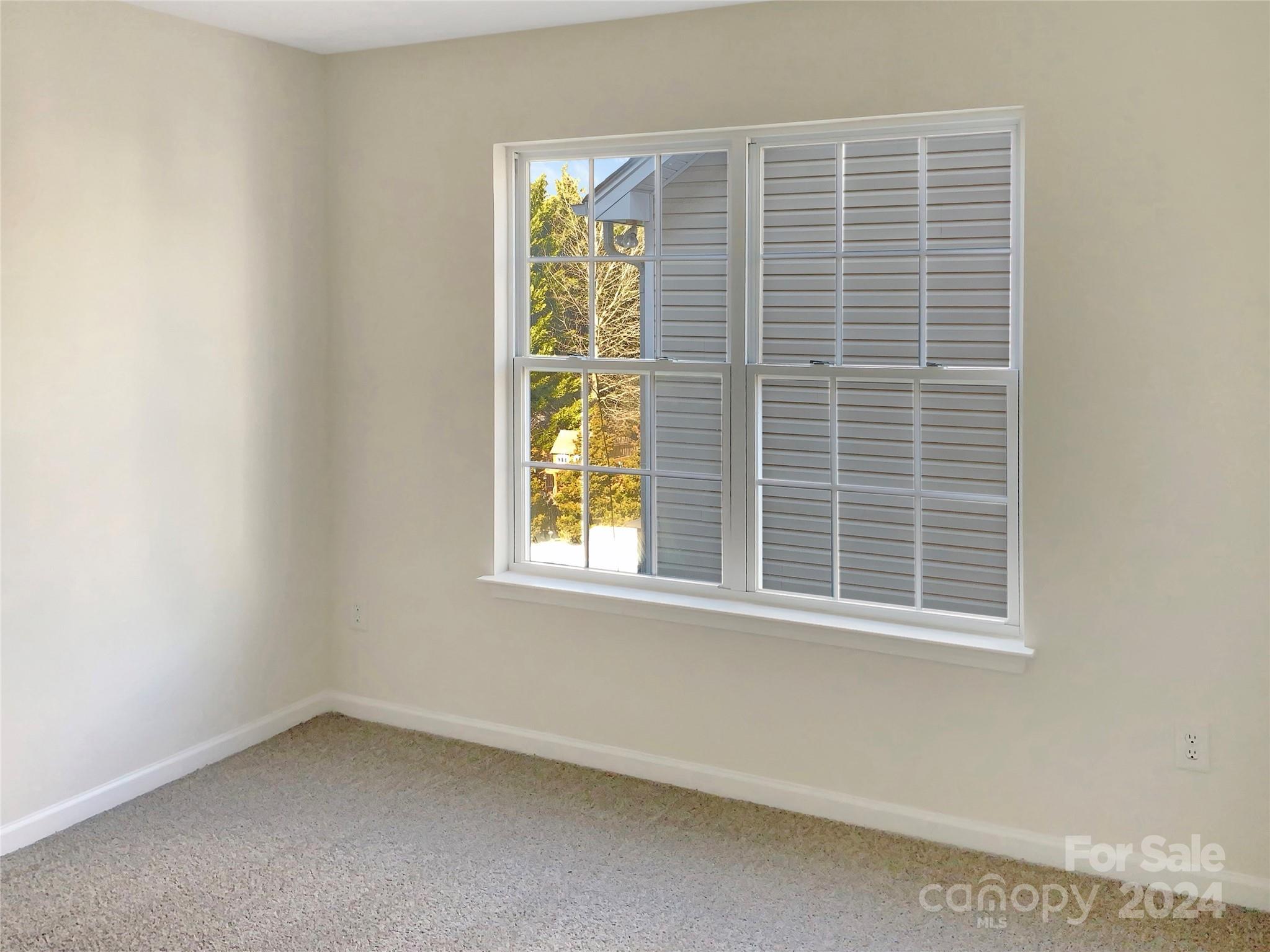 13413 Meadowmere Road Huntersville, NC 28078 - Photo 16 of 22 an empty room with a window