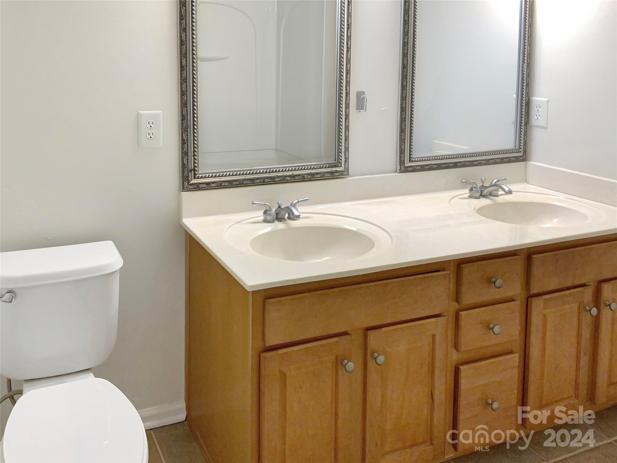 13413 Meadowmere Road Huntersville, NC 28078 - Photo 17 of 22 a bathroom with a sink and a toilet