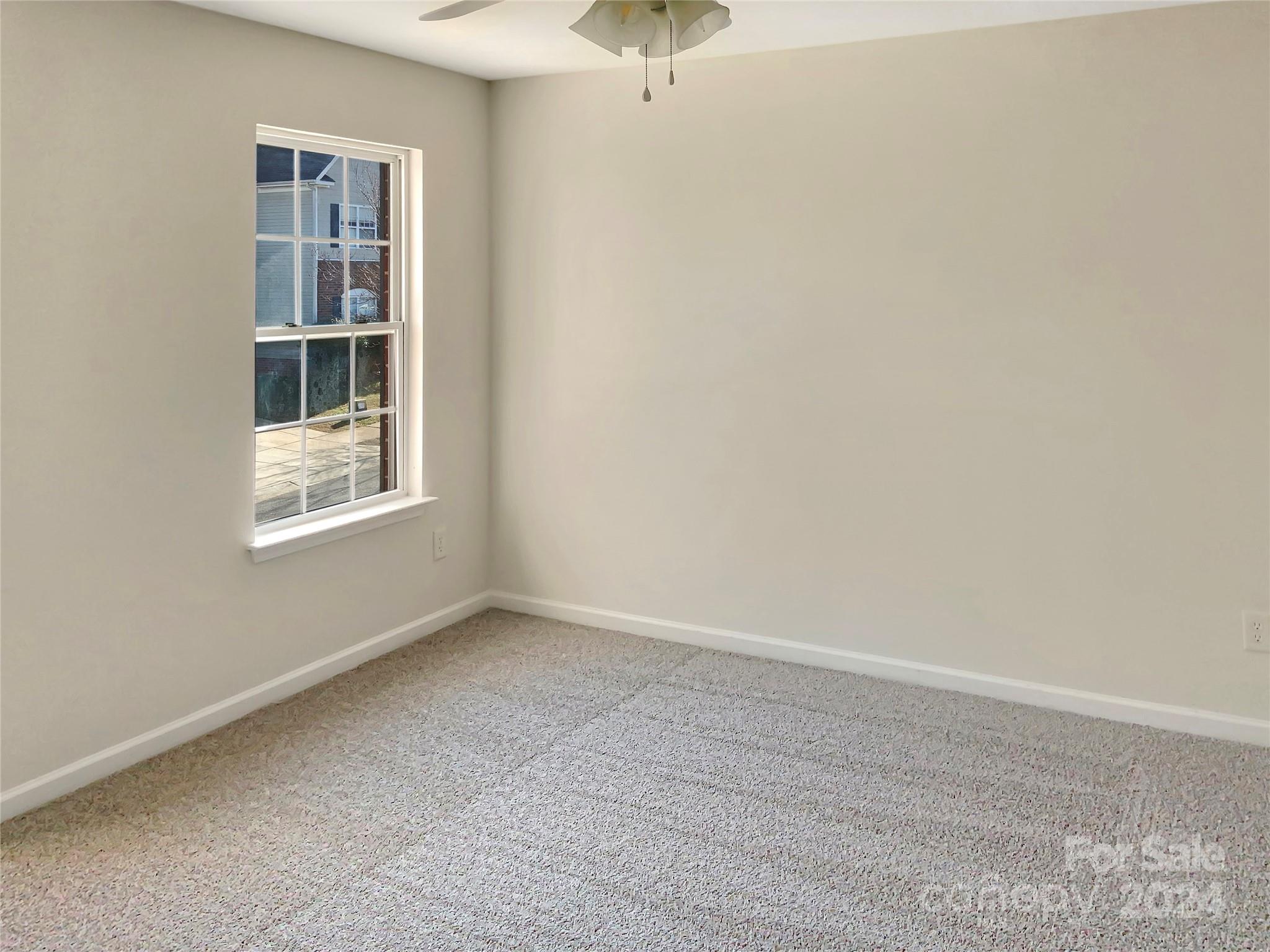 13413 Meadowmere Road Huntersville, NC 28078 - Photo 18 of 22 an empty room with a window