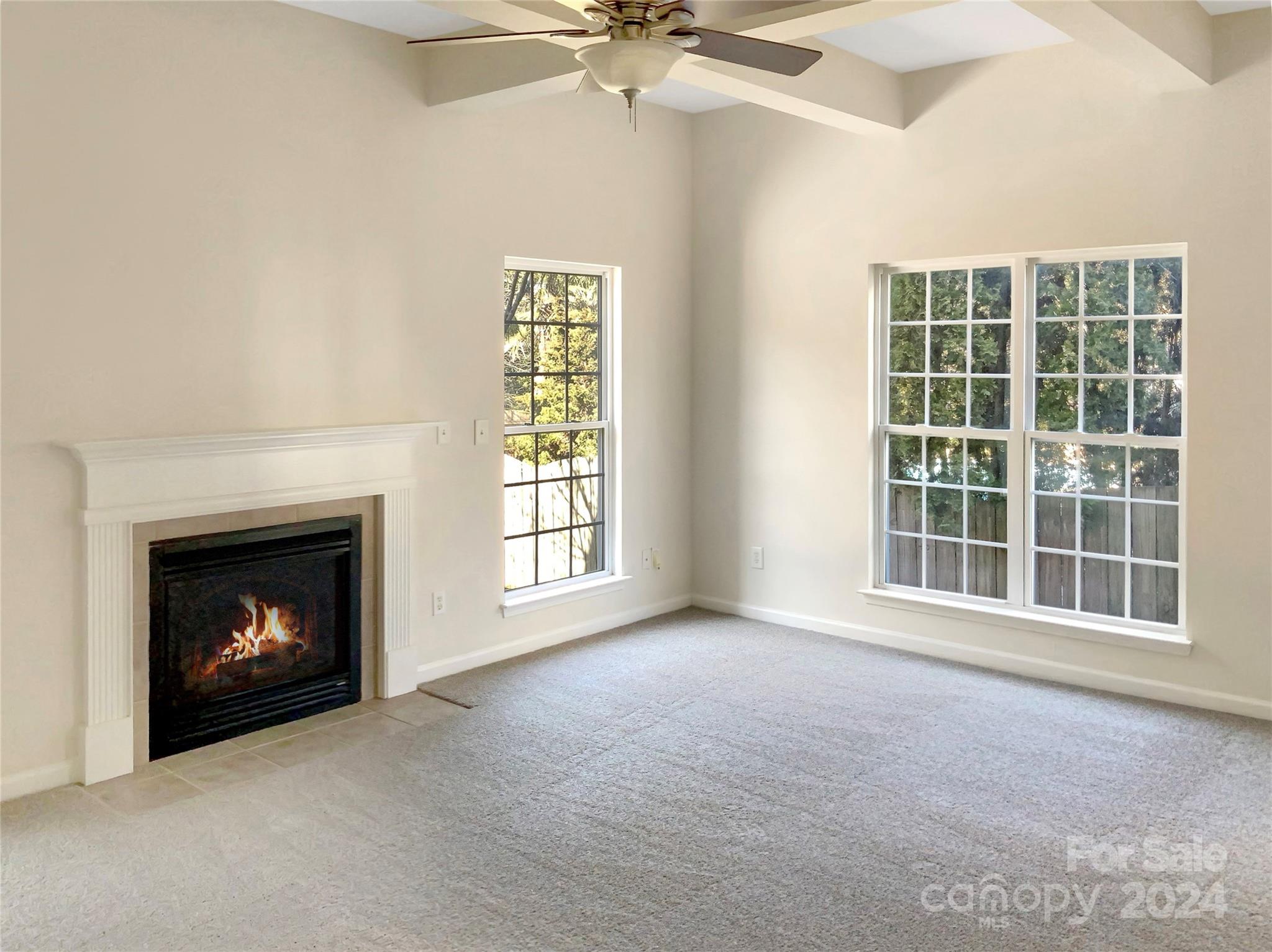 13413 Meadowmere Road Huntersville, NC 28078 - Photo 3 of 22 a view of an empty room with a fireplace and a window