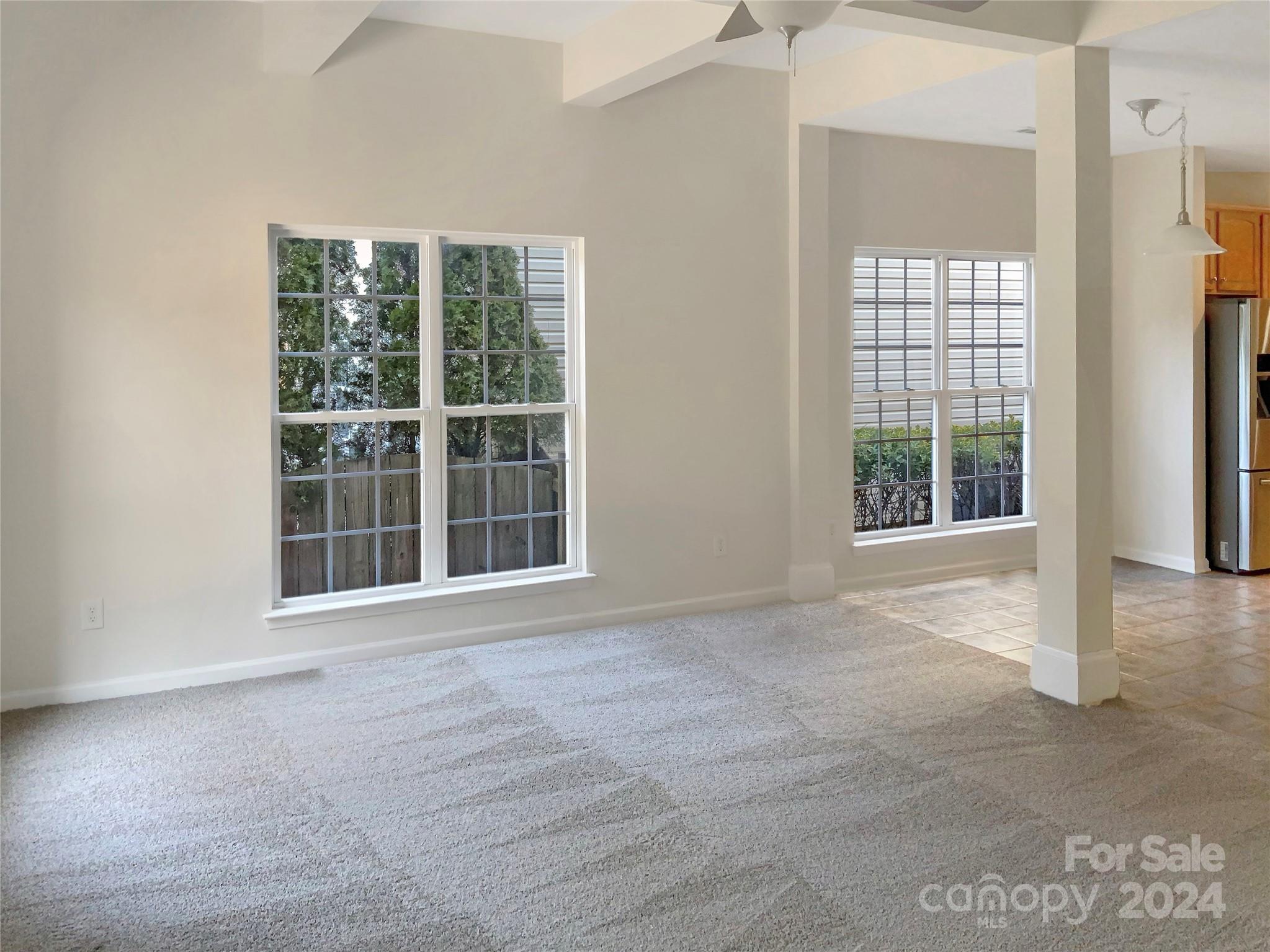 13413 Meadowmere Road Huntersville, NC 28078 - Photo 9 of 22 a view of an empty room with a window