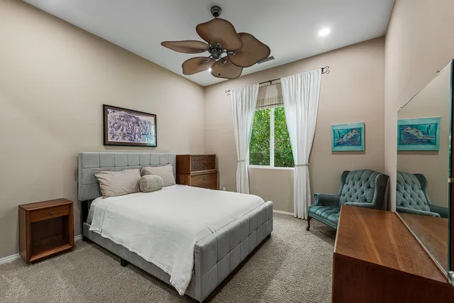 a bedroom with a bed and a couch