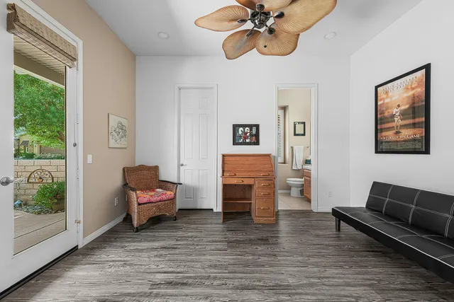 a view of a livingroom with furniture and windows