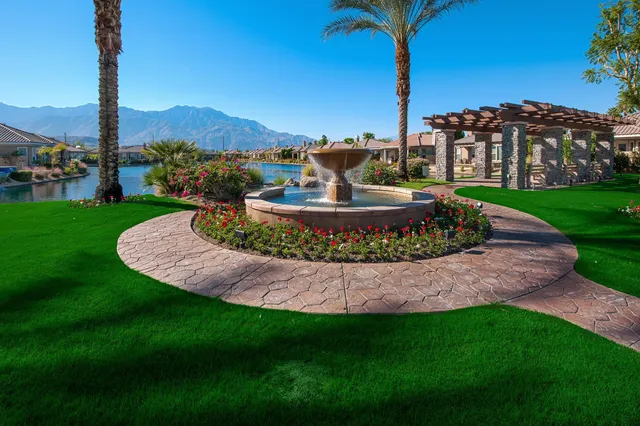 a view of a garden with a building in the background