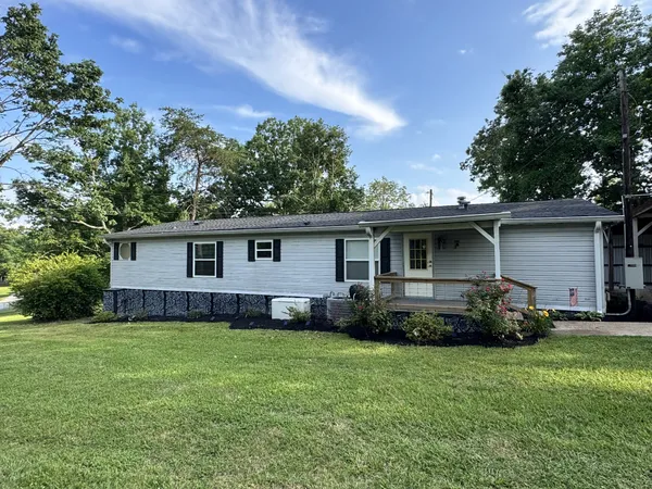 a view of a house of a front side with garden