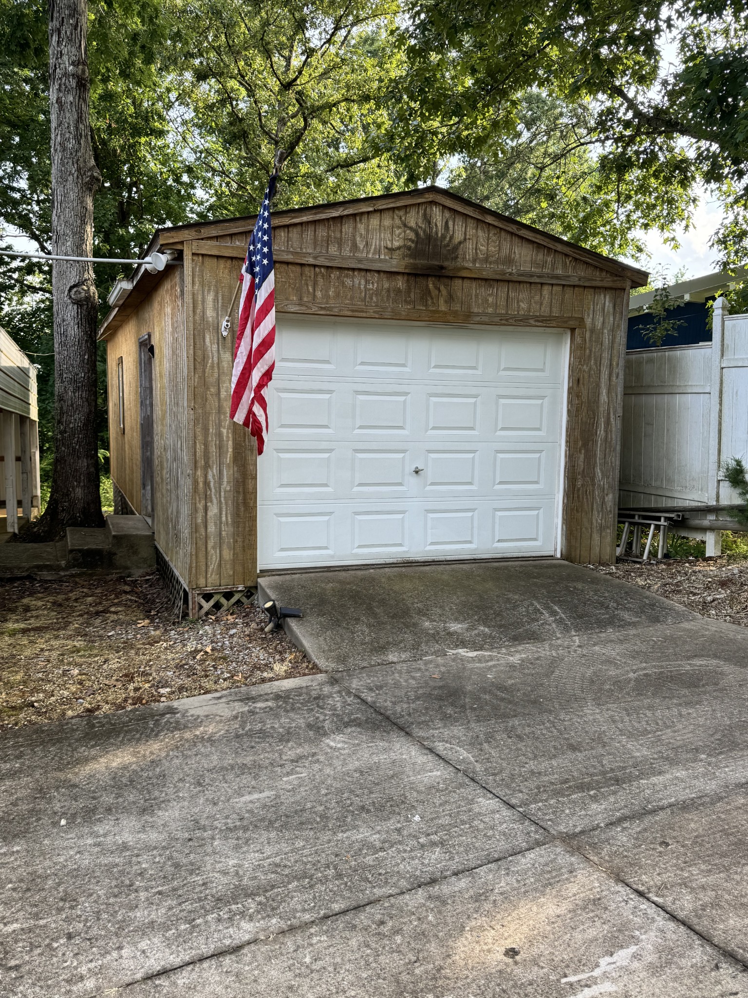 59 Riverview Lane Waverly, TN 37185 - Photo 24 of 28 a view of a wooden house with a small barn