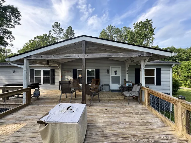 a view of a house with sitting area and furniture