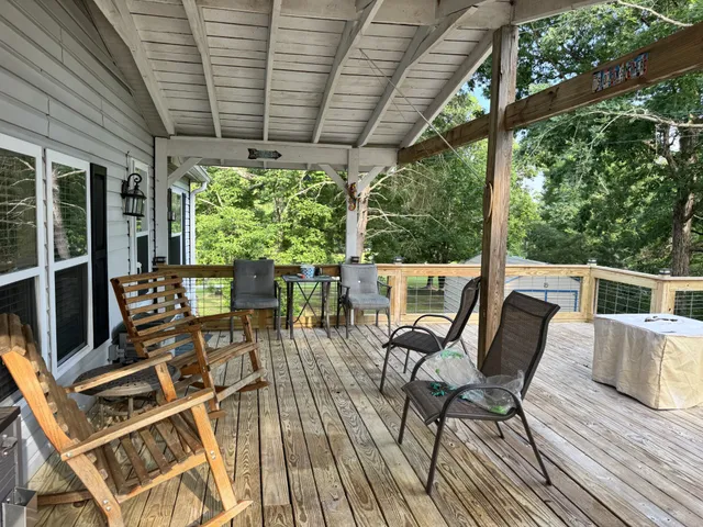 a view of a chairs and table in the balcony