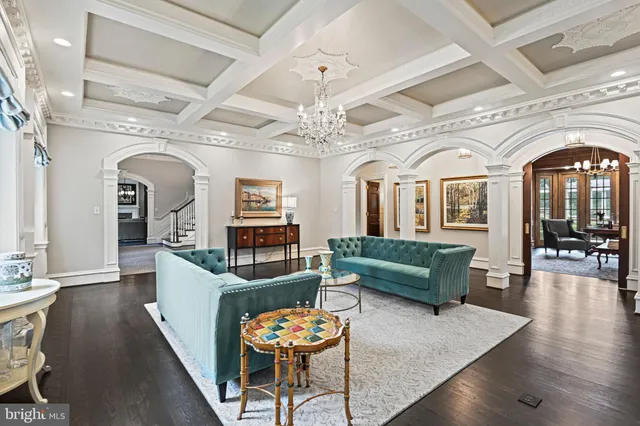 a large kitchen with stainless steel appliances granite countertop a stove a refrigerator a sink dishwasher a dining table and chairs with wooden floor