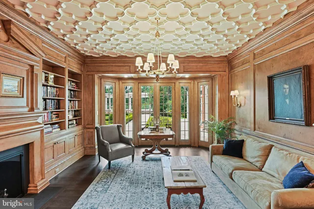 a kitchen with stainless steel appliances granite countertop white cabinets and a stove top oven