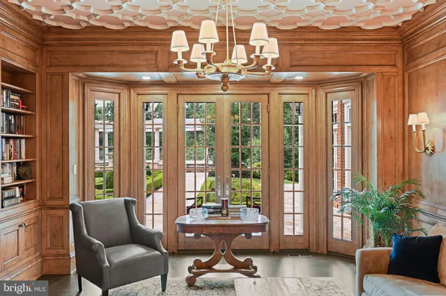 a bathroom with a granite countertop sink a mirror and a shower