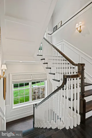 a spacious bathroom with a granite countertop sink and a mirror