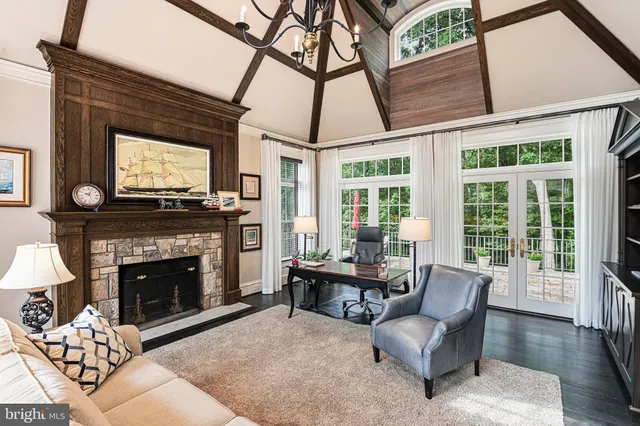 a view of a livingroom with wooden floor and windows