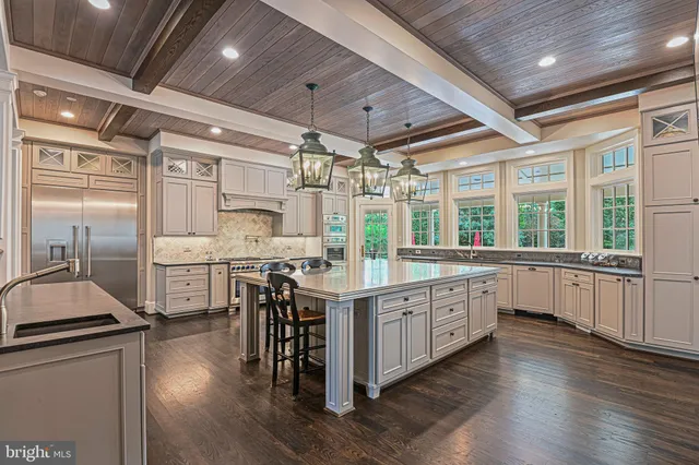 a bathroom with a granite countertop sink a toilet and a mirror