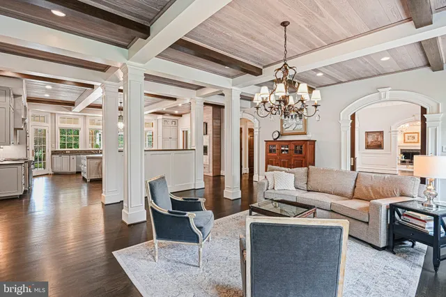 a view of a dining room with furniture wooden floor and chandelier