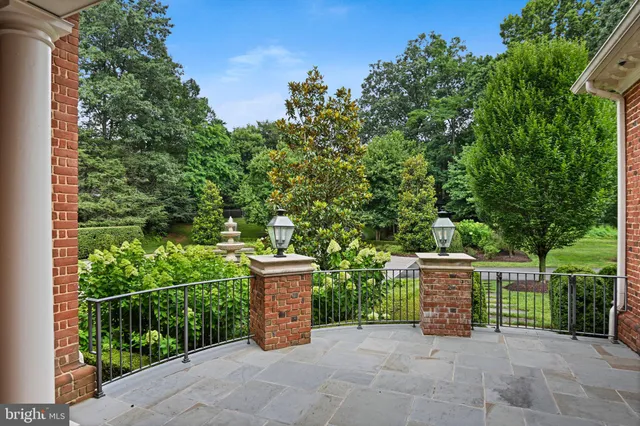 a view of a building with sitting area and furniture