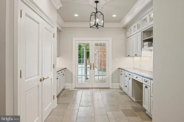 a bathroom with a granite countertop sink a toilet a mirror and shower