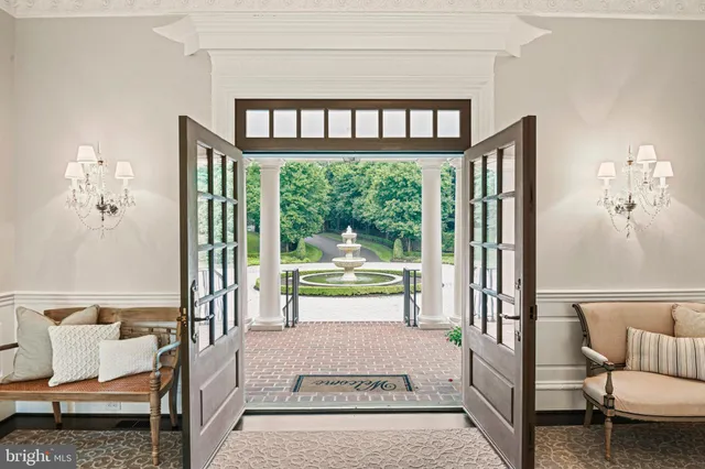 a living room with furniture and large windows