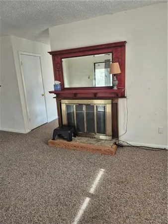 a view of a room with shelf on the wall