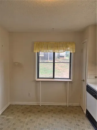 a living room with furniture a window and a table