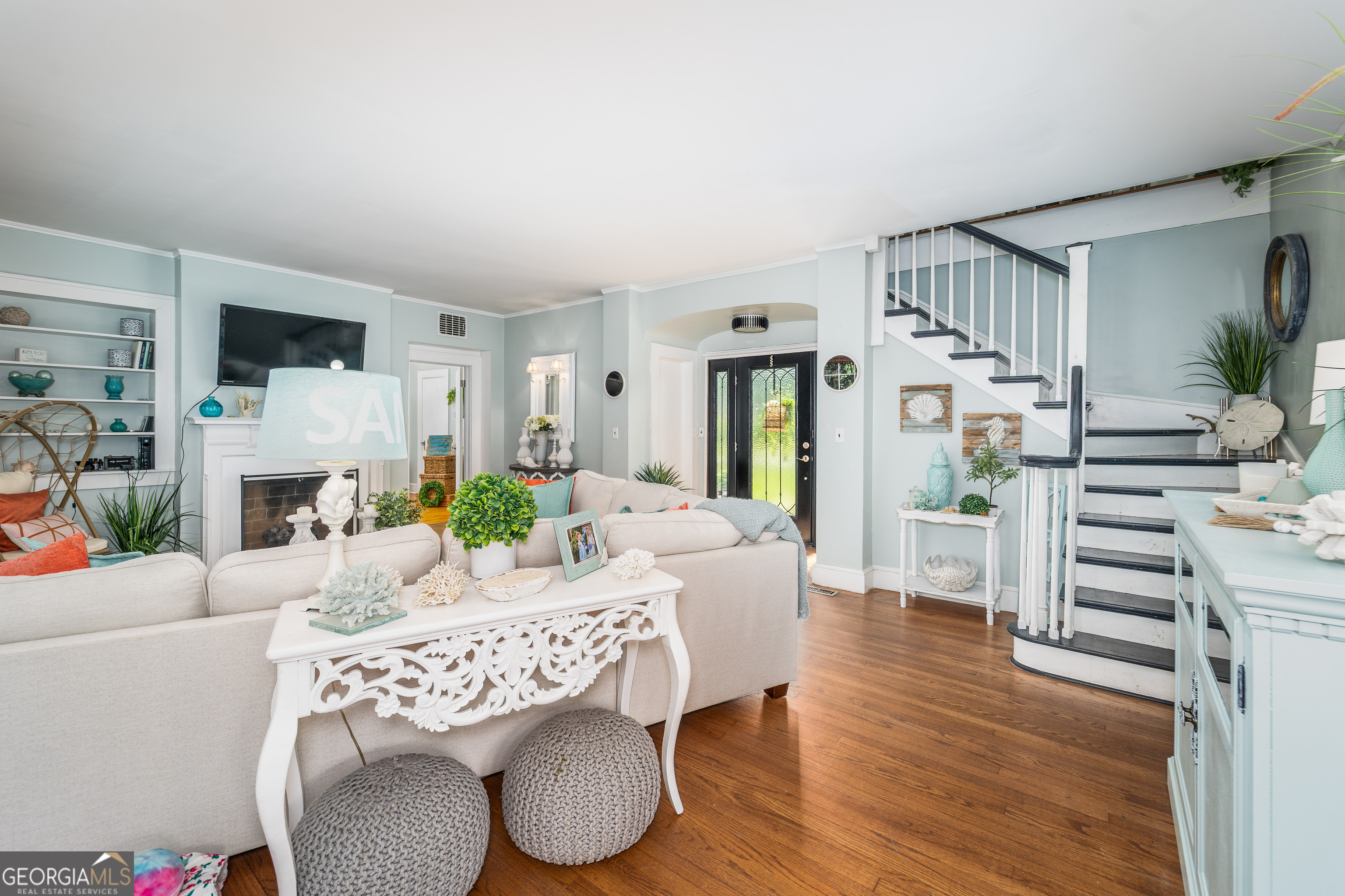 1101 Cherokee Drive Waycross, GA 31501 - Photo 12 of 24 a living room with furniture a fireplace and a table