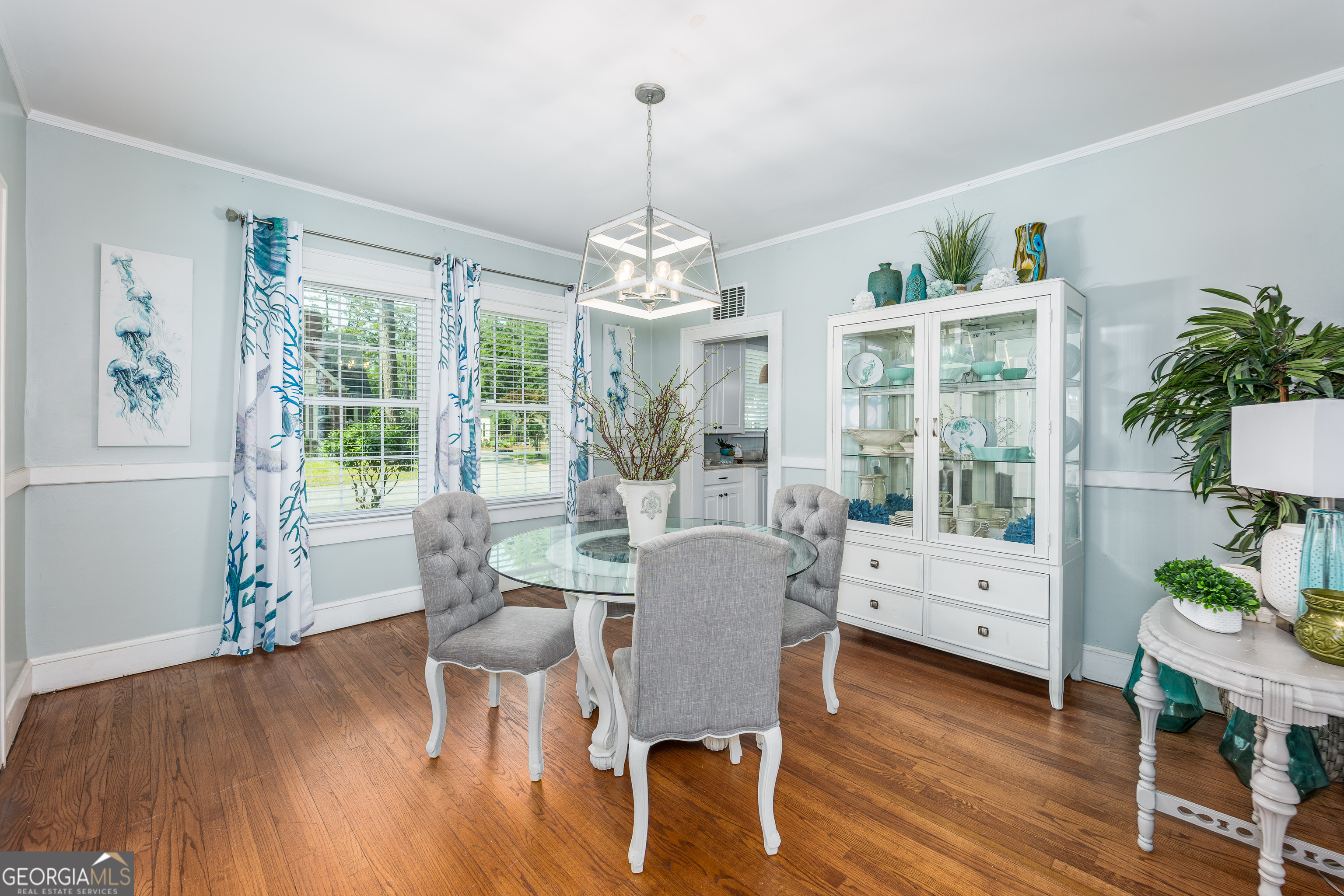 1101 Cherokee Drive Waycross, GA 31501 - Photo 13 of 24 a view of a dining room with furniture window and wooden floor