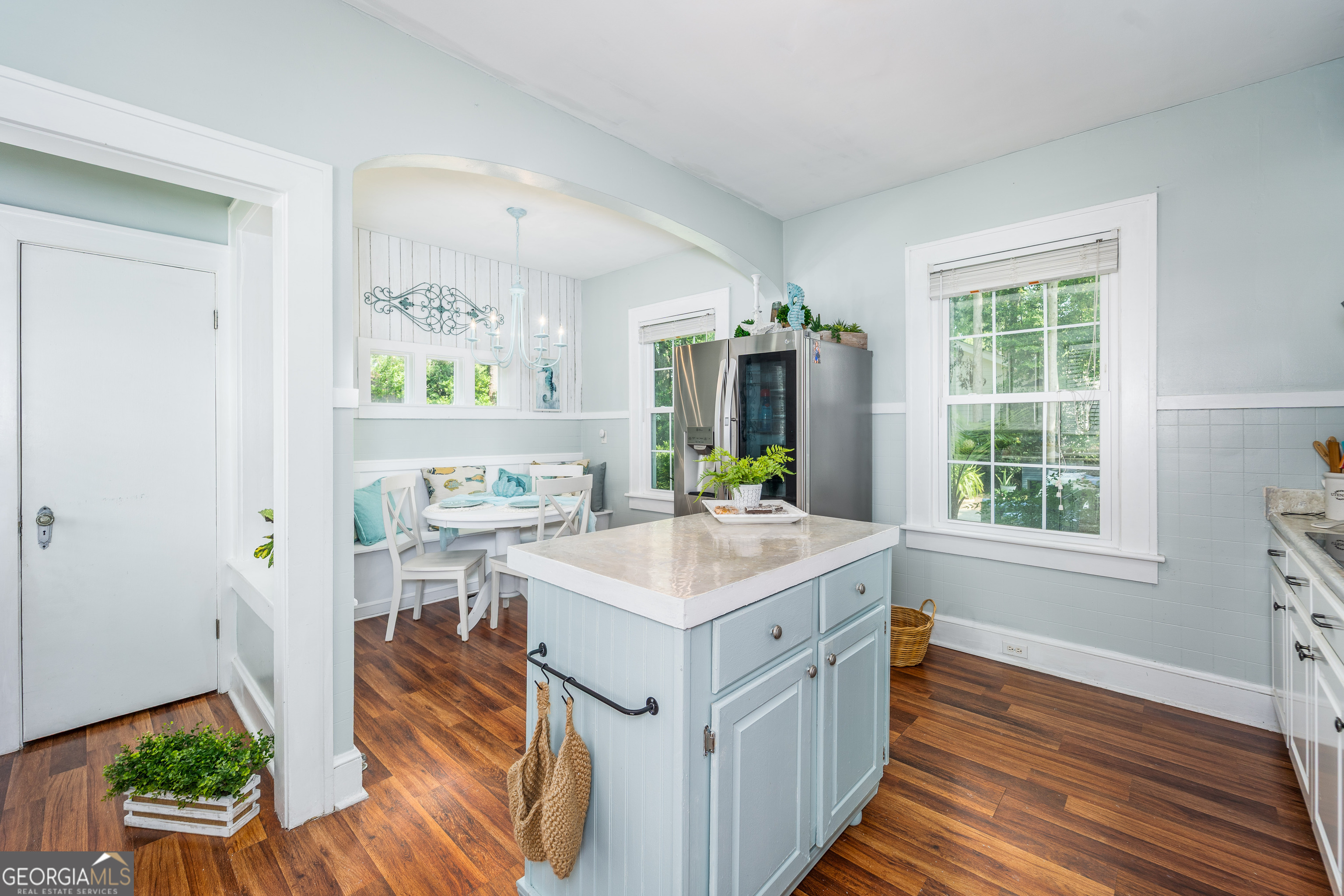 1101 Cherokee Drive Waycross, GA 31501 - Photo 14 of 24 a open kitchen with a sink stove and wooden floor