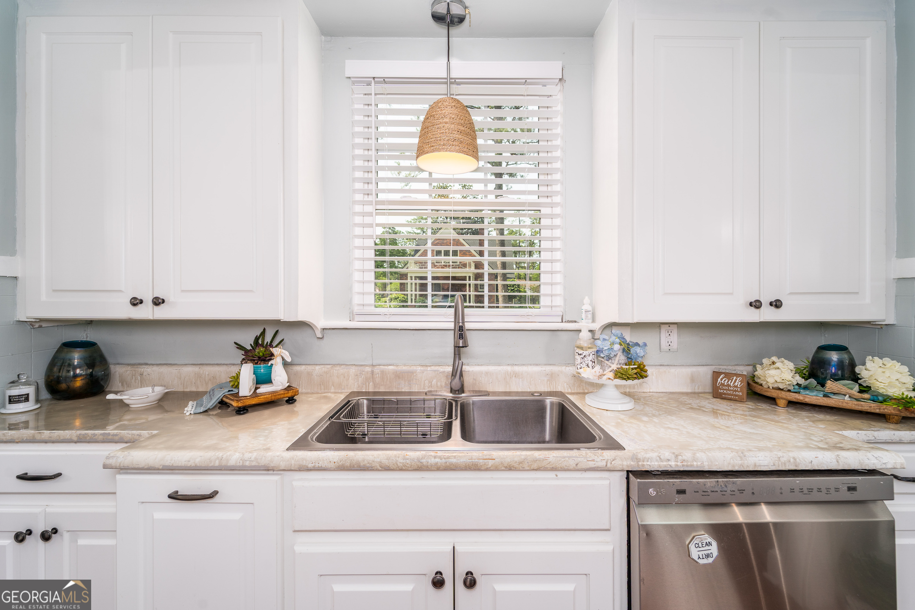1101 Cherokee Drive Waycross, GA 31501 - Photo 16 of 24 a kitchen with a sink cabinets and window