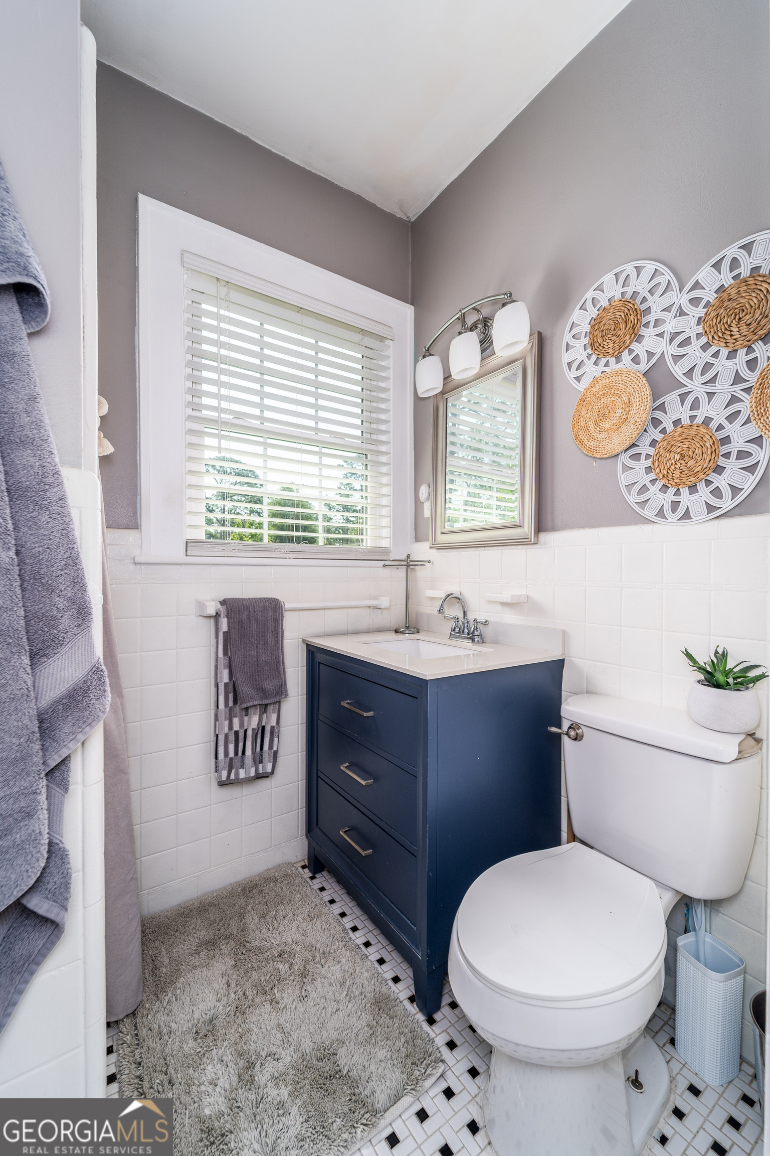 1101 Cherokee Drive Waycross, GA 31501 - Photo 22 of 24 a bathroom with a toilet sink and mirror