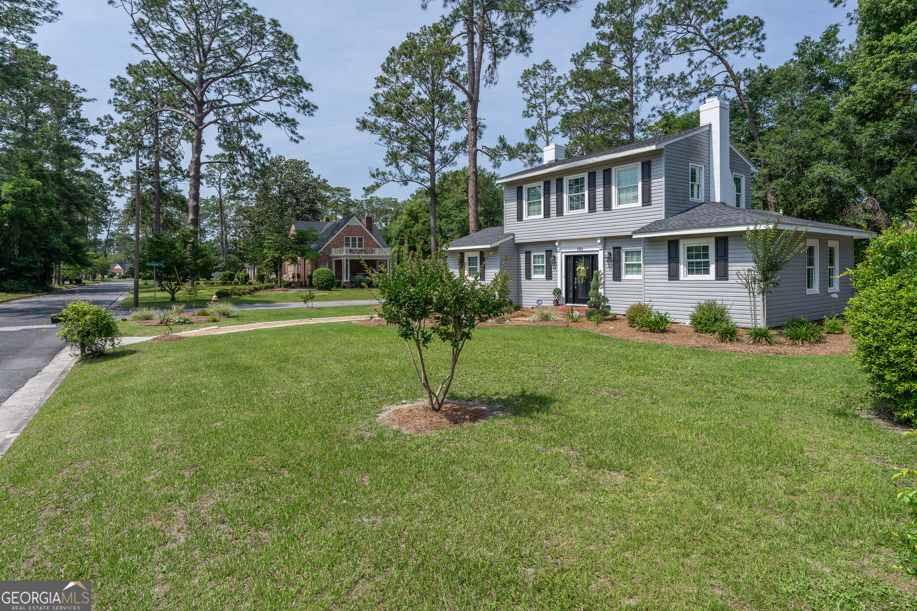 1101 Cherokee Drive Waycross, GA 31501 - Photo 4 of 24 a front view of a house with a yard