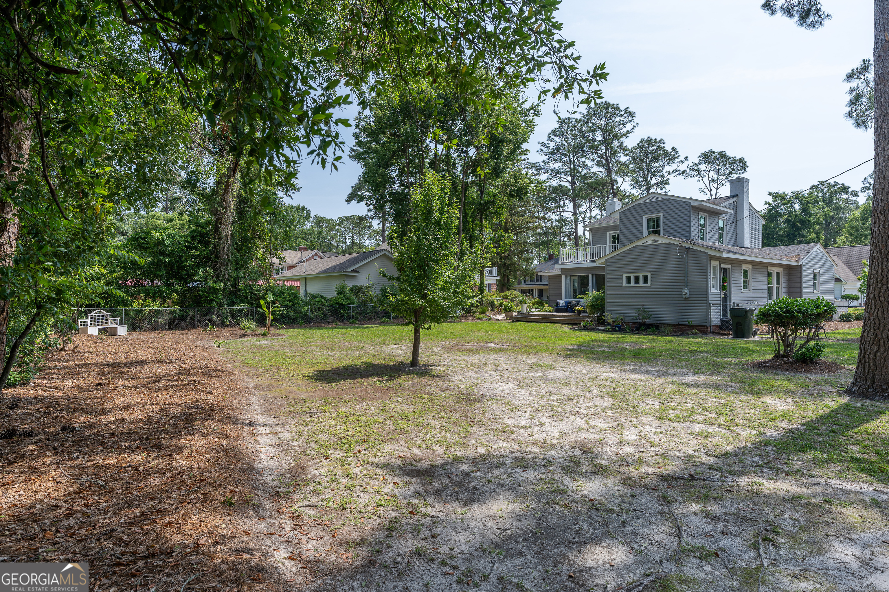 1101 Cherokee Drive Waycross, GA 31501 - Photo 7 of 24 a house with a tree in front of it