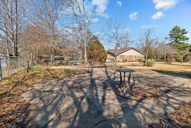 a view of yard along with trees