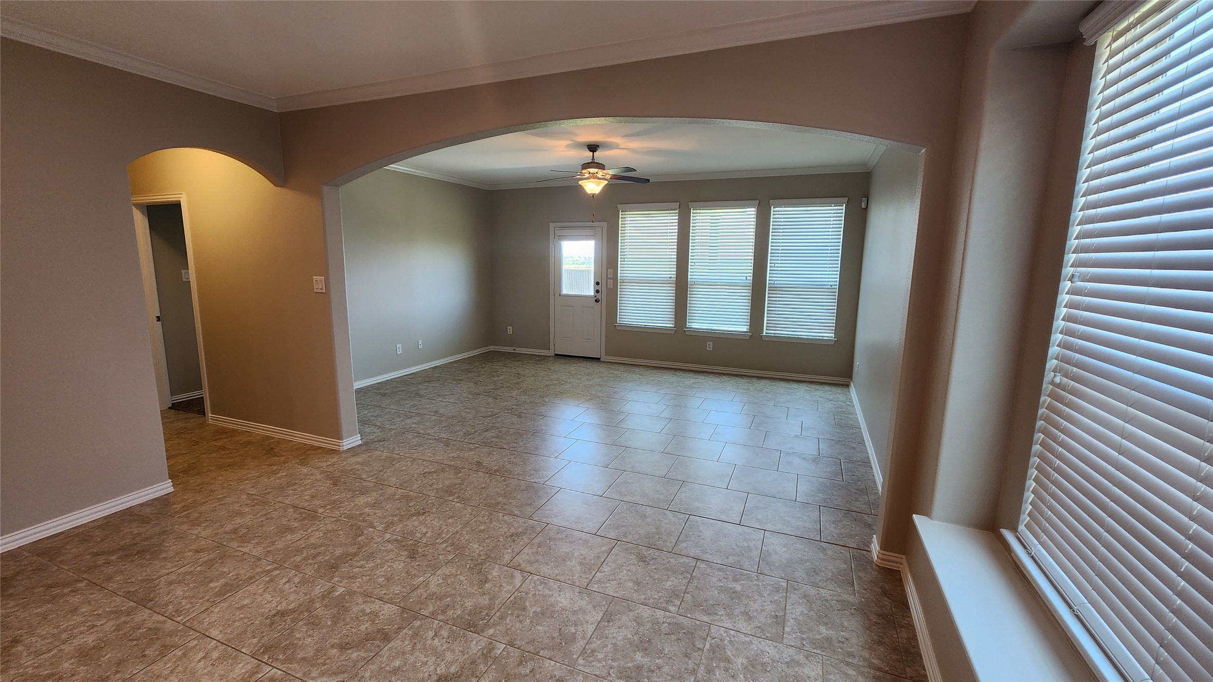 18428 Blush Rose Road Pflugerville, TX 78660 - Photo 15 of 32 Breakfast area to the family room. The kichen and breakfast area has crown molding as does the family room.