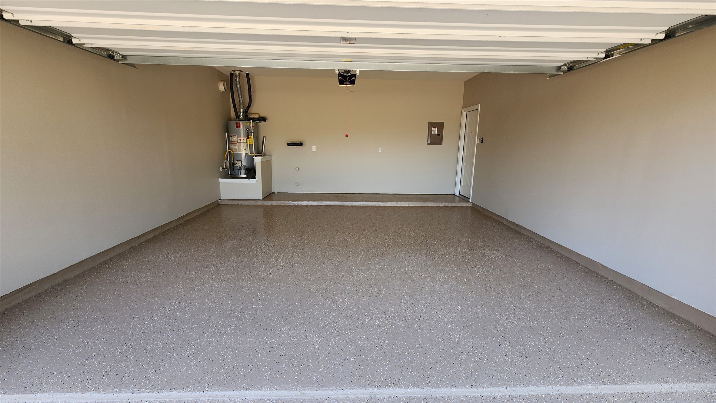 18428 Blush Rose Road Pflugerville, TX 78660 - Photo 24 of 32 Professional paint and epoxy floor. Walls painted to match the interior of the house. The garage door is insulated.