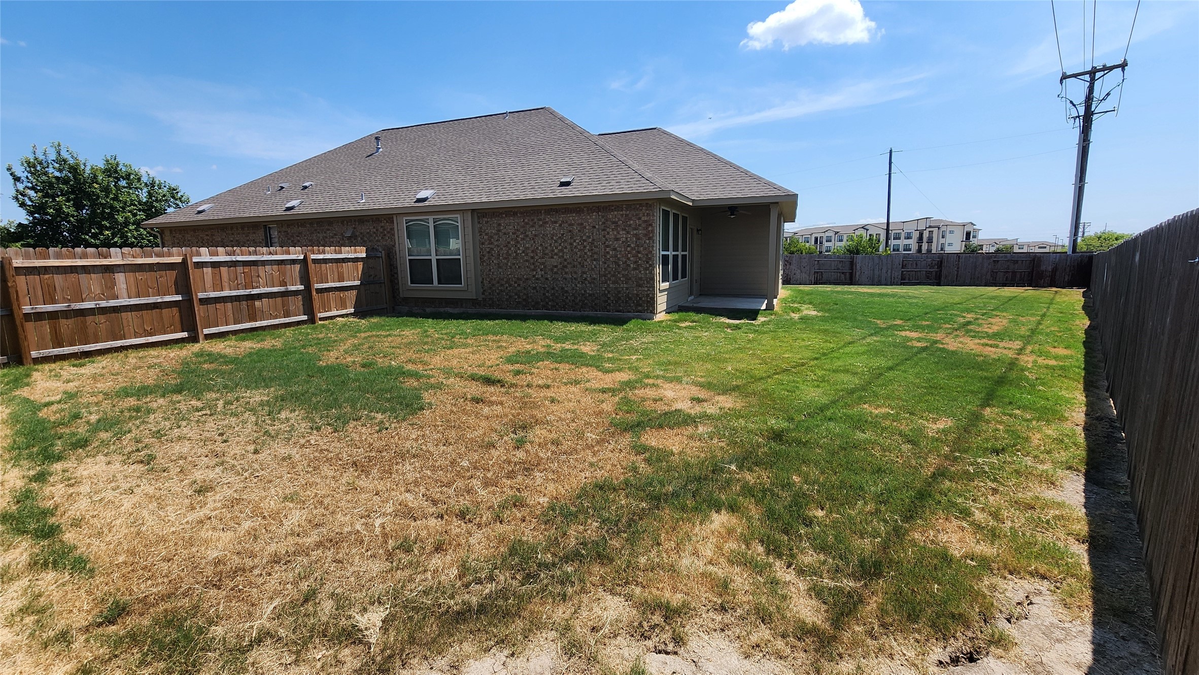 18428 Blush Rose Road Pflugerville, TX 78660 - Photo 30 of 32 Large back which gives spacing between the side neighbors. The back fence is aprox 125 feet long. This is a premium lot. The roof was recently replaced also with architectural shingles.