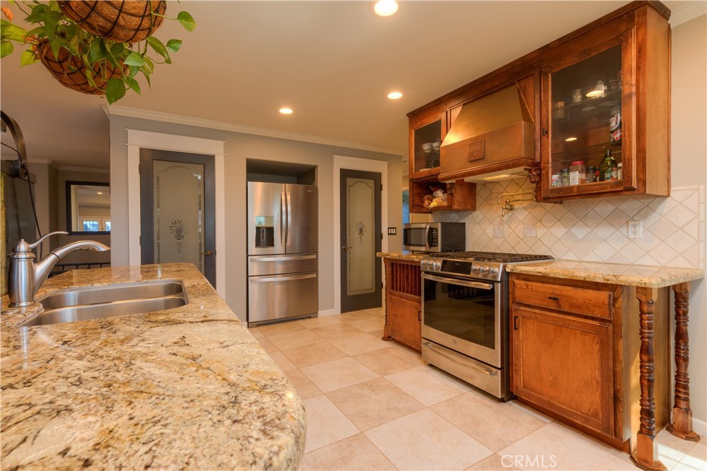 3929 Pardes Way Paradise, CA 95969 - Photo 18 of 73 a kitchen with stainless steel appliances granite countertop a stove and a sink