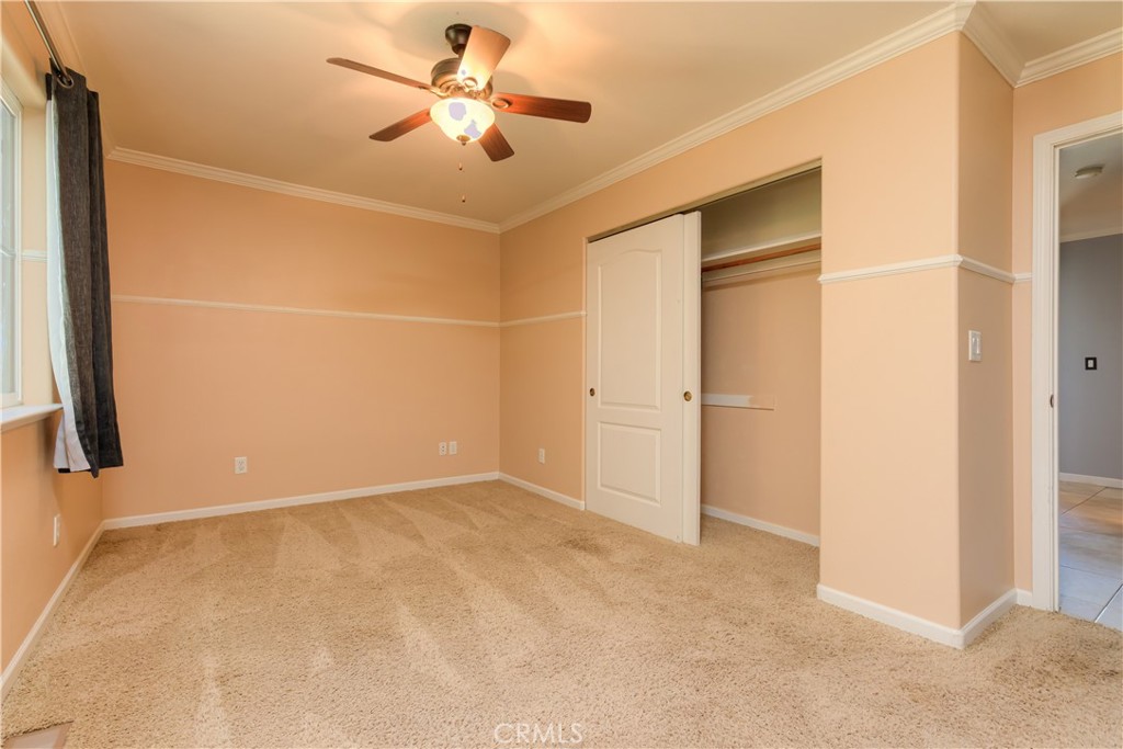 3929 Pardes Way Paradise, CA 95969 - Photo 28 of 73 an empty room with closet and a chandelier fan