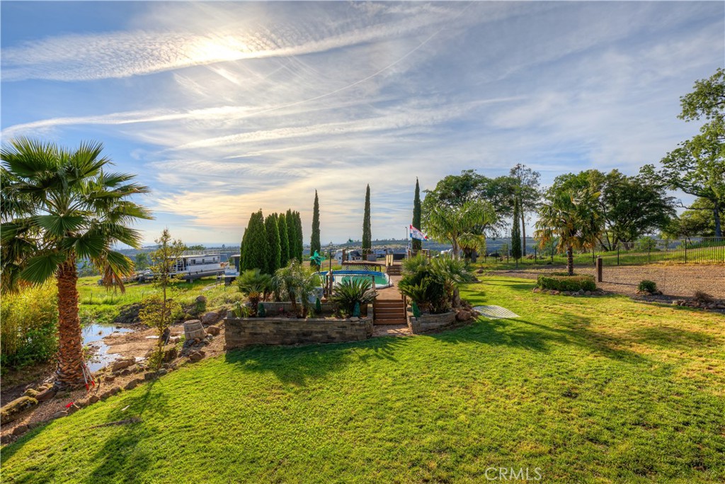 3929 Pardes Way Paradise, CA 95969 - Photo 53 of 73 a view of a swimming pool with a garden and plants