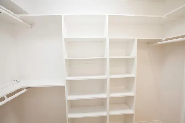 a view of an empty walk in closet