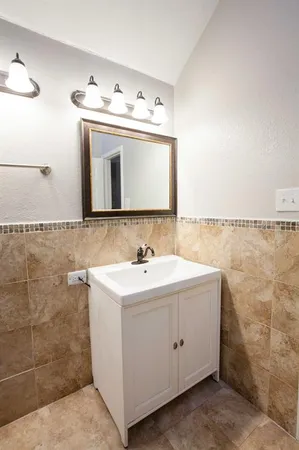 a view of bathroom with dual sinks