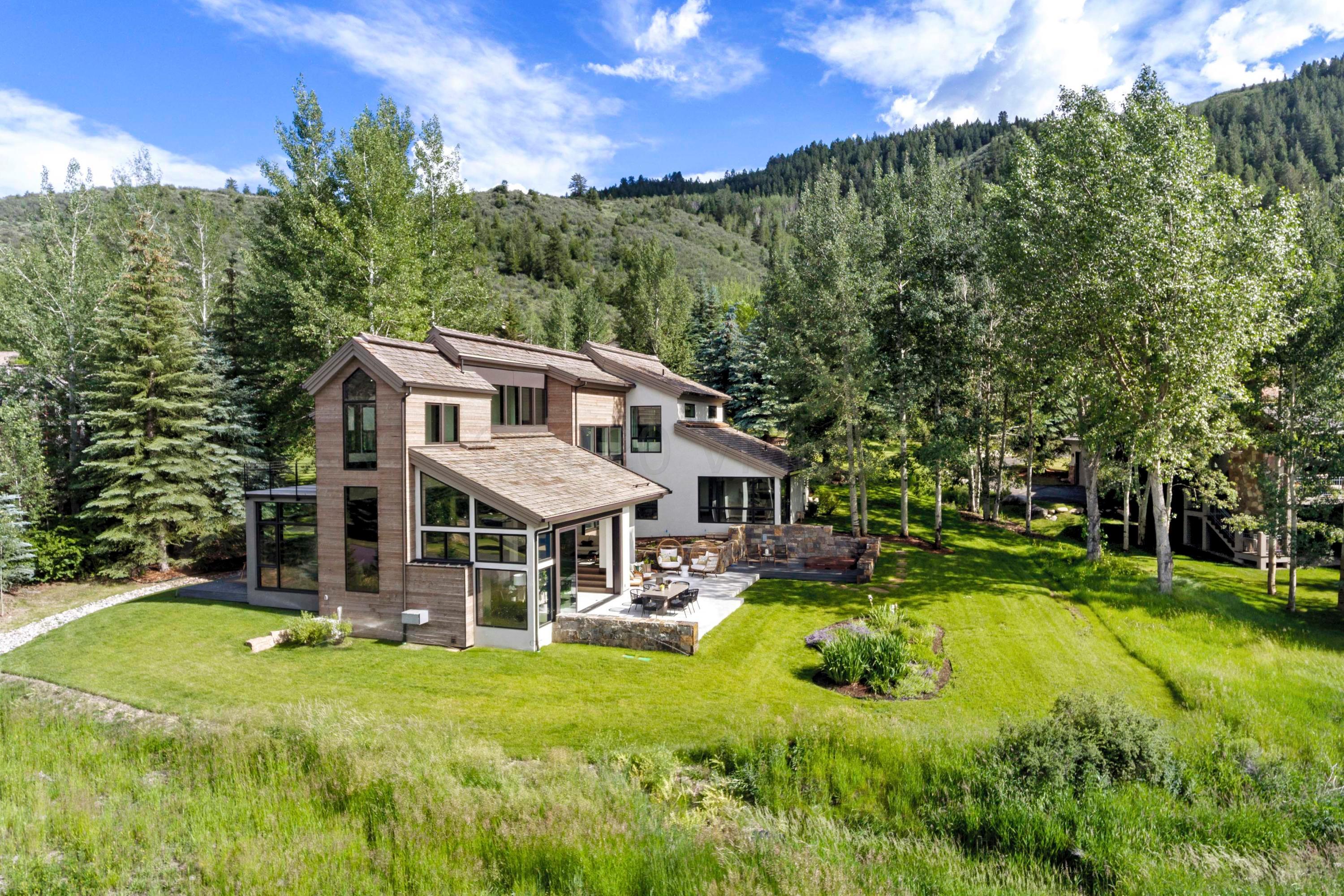 144 Castle Peak Gate Edwards, CO 81632 - Photo 1 of 46 a view of a house with a big yard patio and swimming pool
