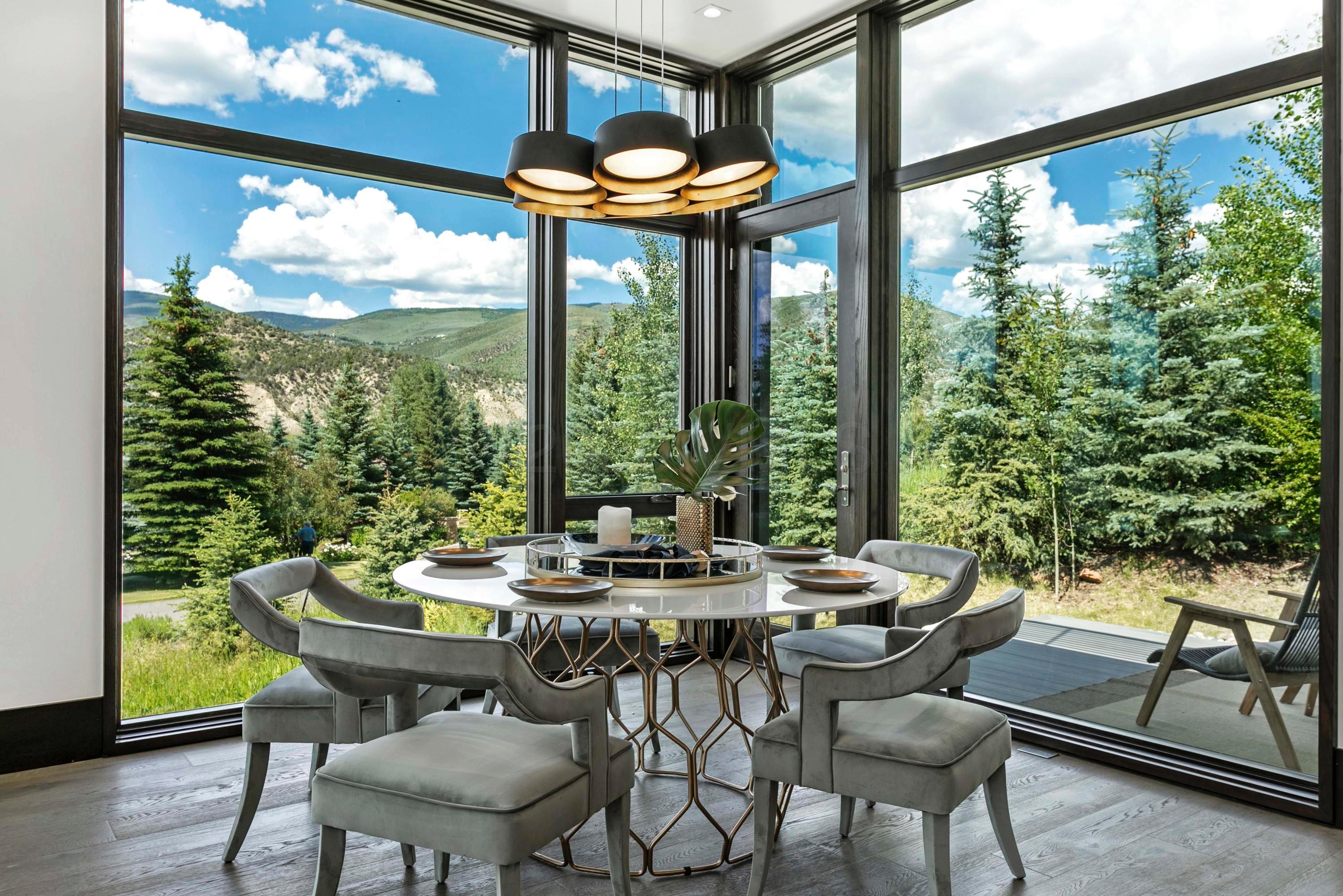 144 Castle Peak Gate Edwards, CO 81632 - Photo 11 of 46 a view of a dining room with furniture window and outside view