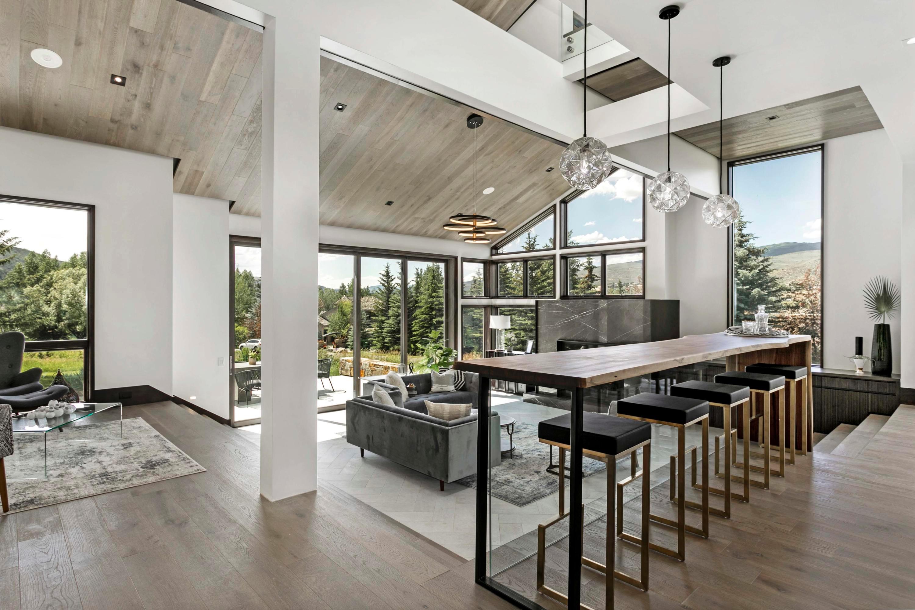 144 Castle Peak Gate Edwards, CO 81632 - Photo 14 of 46 a view of a dining room with furniture window and wooden floor