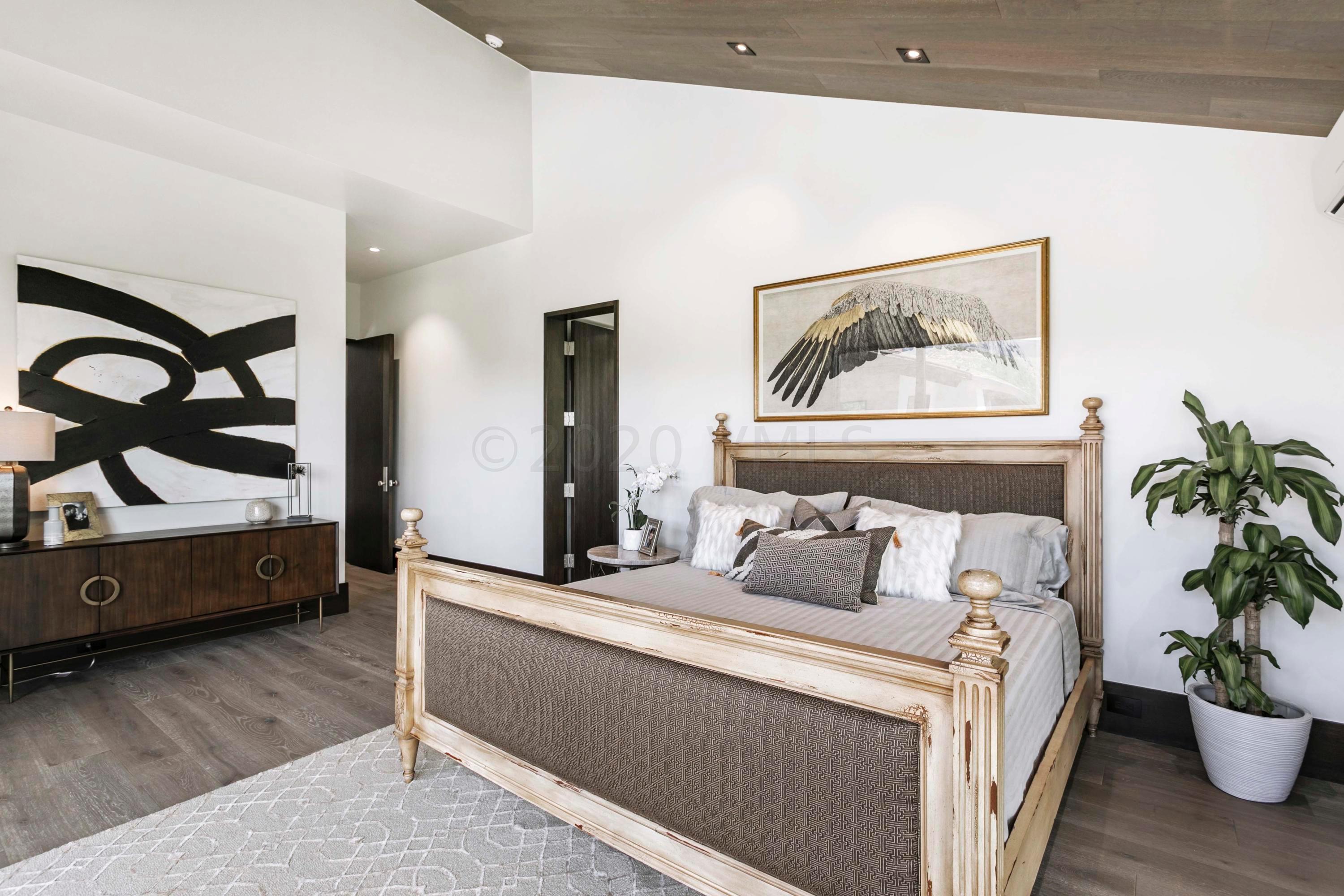 144 Castle Peak Gate Edwards, CO 81632 - Photo 17 of 46 a bedroom with a bed and a potted plant