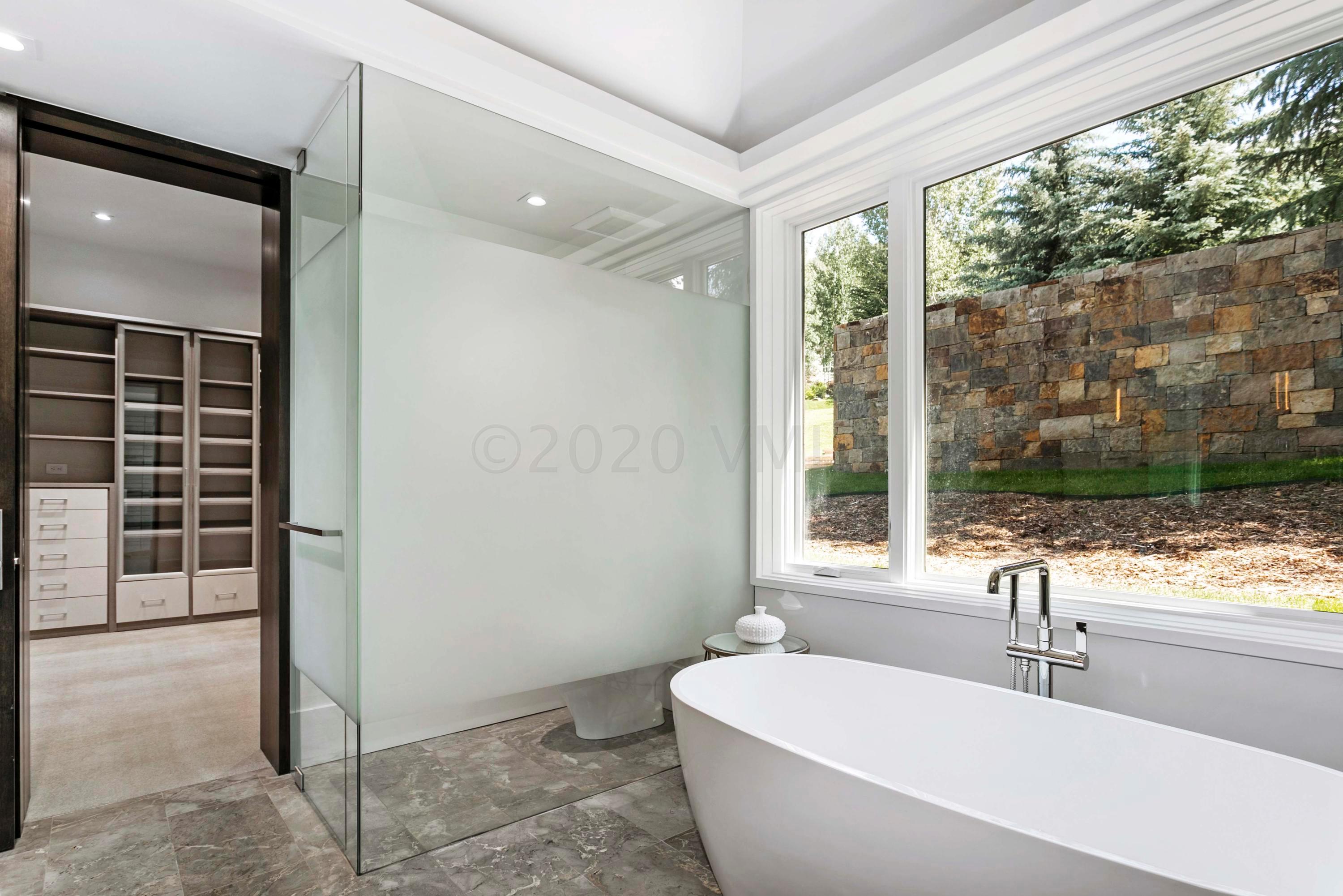 144 Castle Peak Gate Edwards, CO 81632 - Photo 19 of 46 a bathroom with a sink and a large mirror
